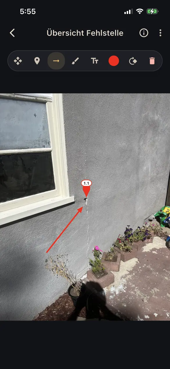A building defect annotated in QuickReports on a smartphone