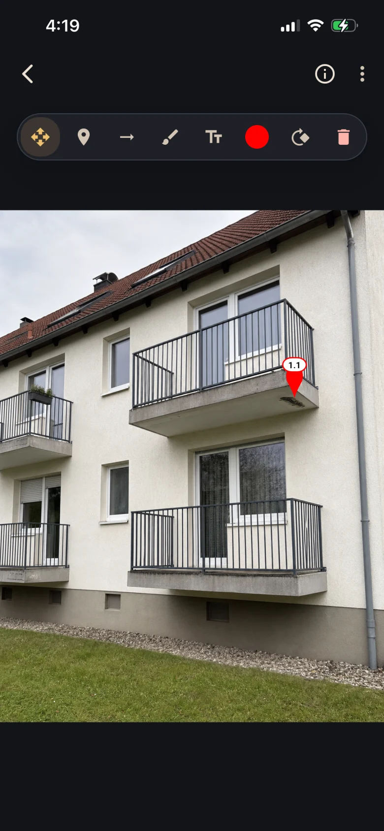Overview photo: Pin 1.1 shows the balcony slab in its spatial context.